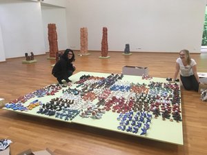 Interns set up the ceramic exhibition, May 2019